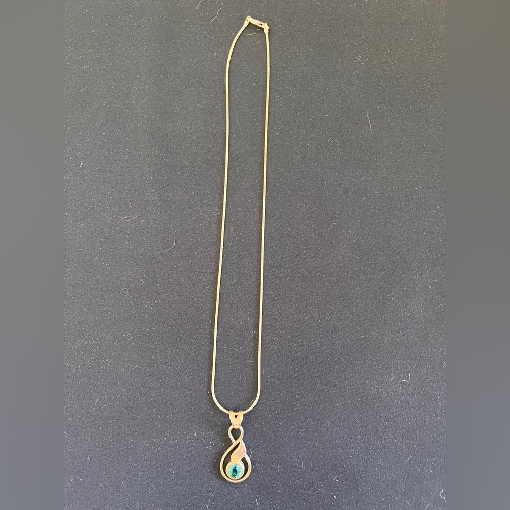 Sterling silver necklace with blue crystal